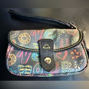 Dooney & Bourke “Graffiti “ coated canvas wristlet with leather trim.